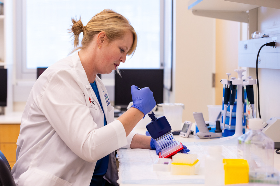 woman in lab smiling