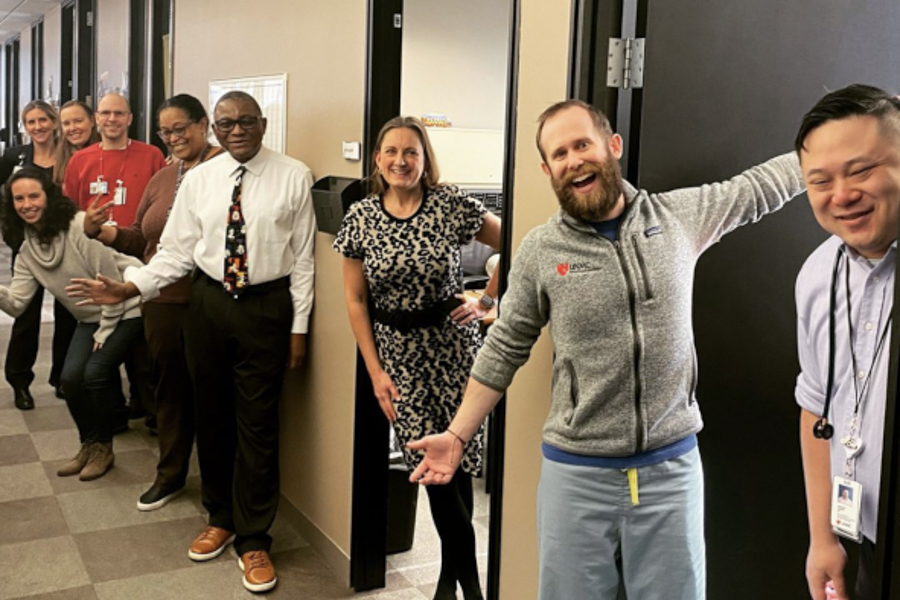 members of the infectious diseases division standing the hallway