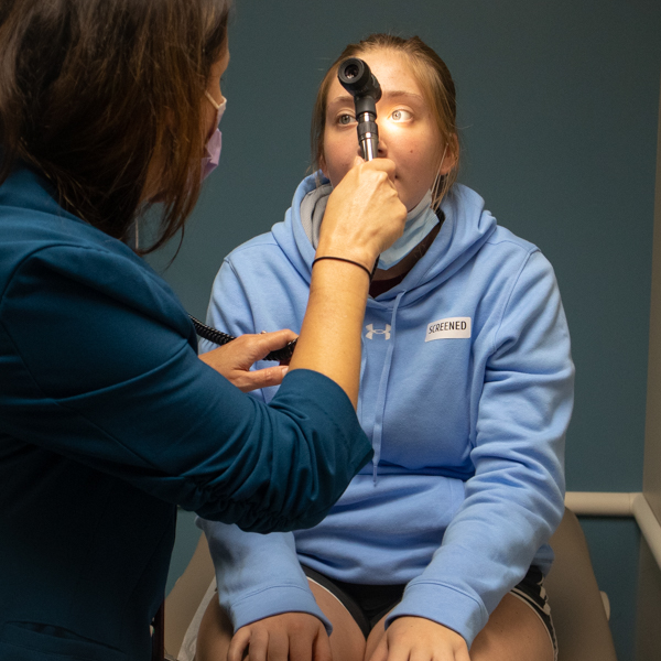 Nephrologist examining patient.