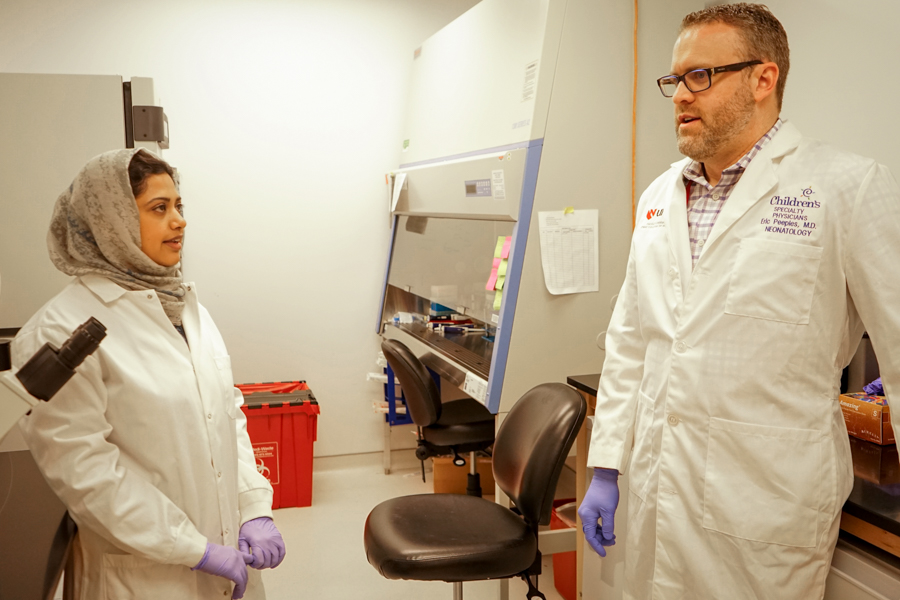 man and women in lab coats