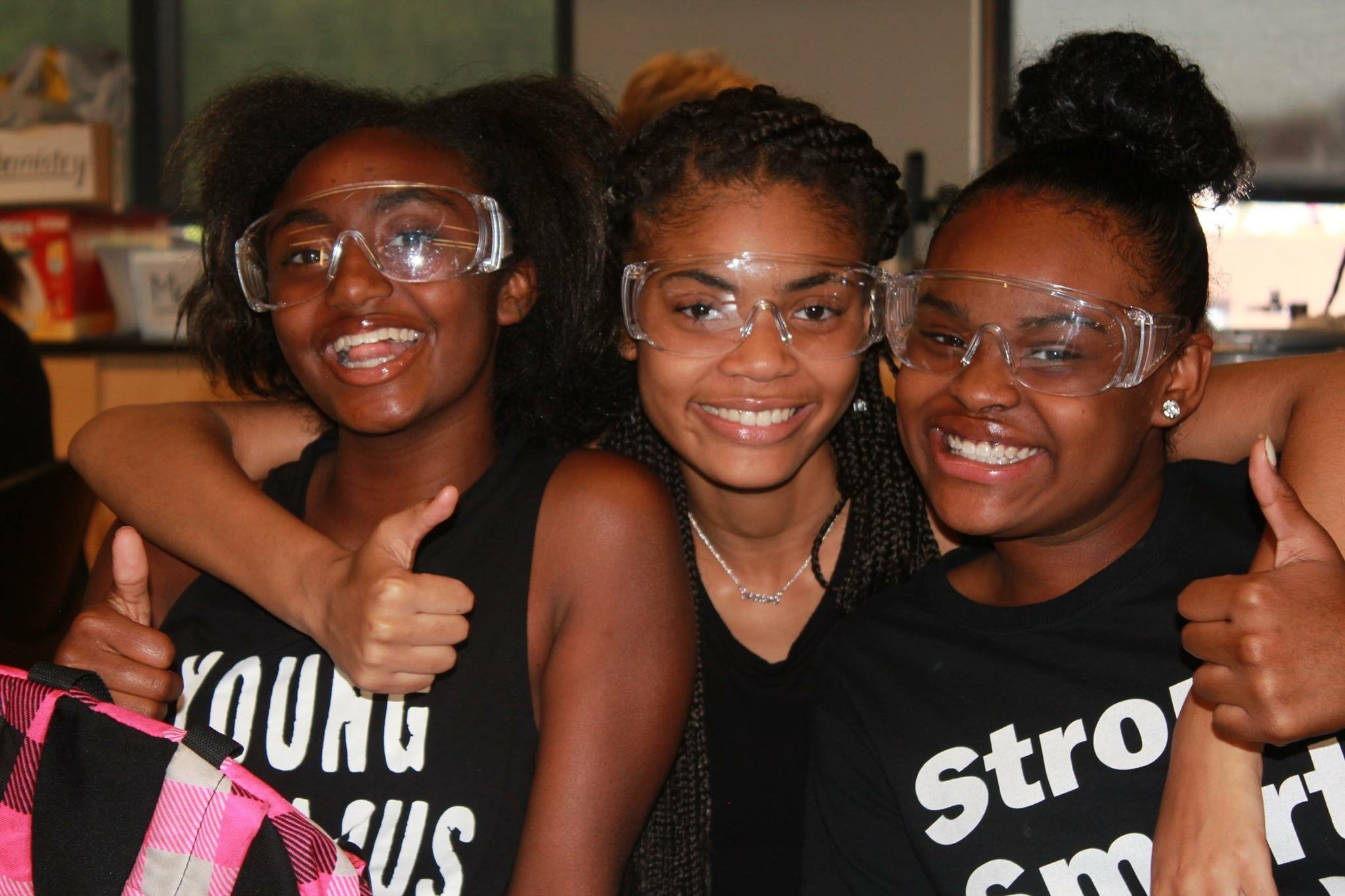 group of girls of three girls wearing black shirts