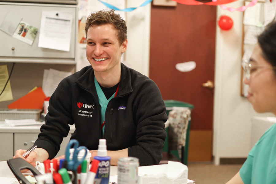 Fellow smiling at table