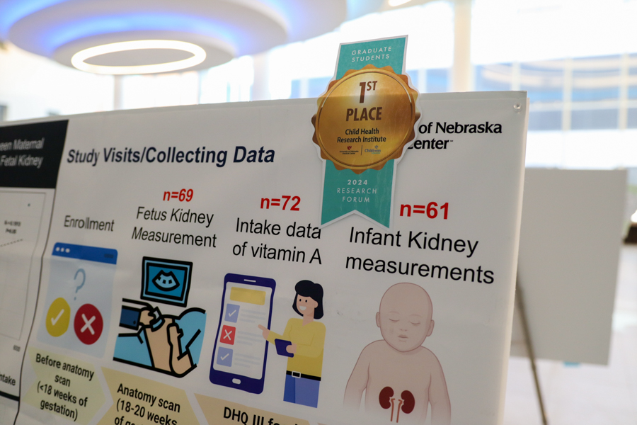 research poster with ribbon on it