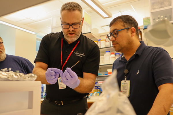 Dr. Peeples in lab with coworker