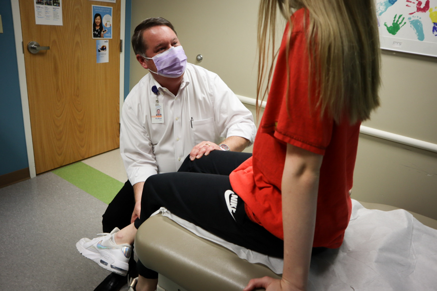 Physician examining a patient