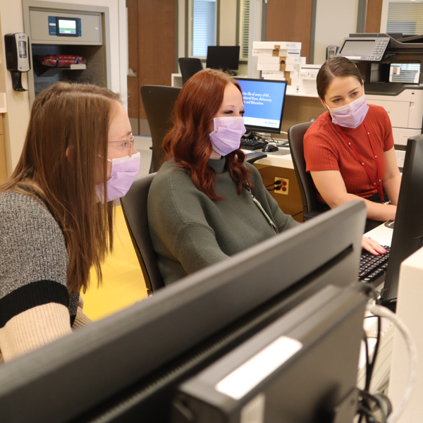 fellows looking at computer screen