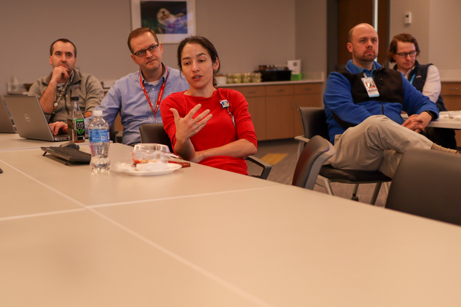 faculty members sitting at a table talking