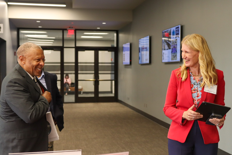 Dr. Ann Anderson Berry and Omaha Mayor John Ewing share a smile at perinatal and maternal health conference.