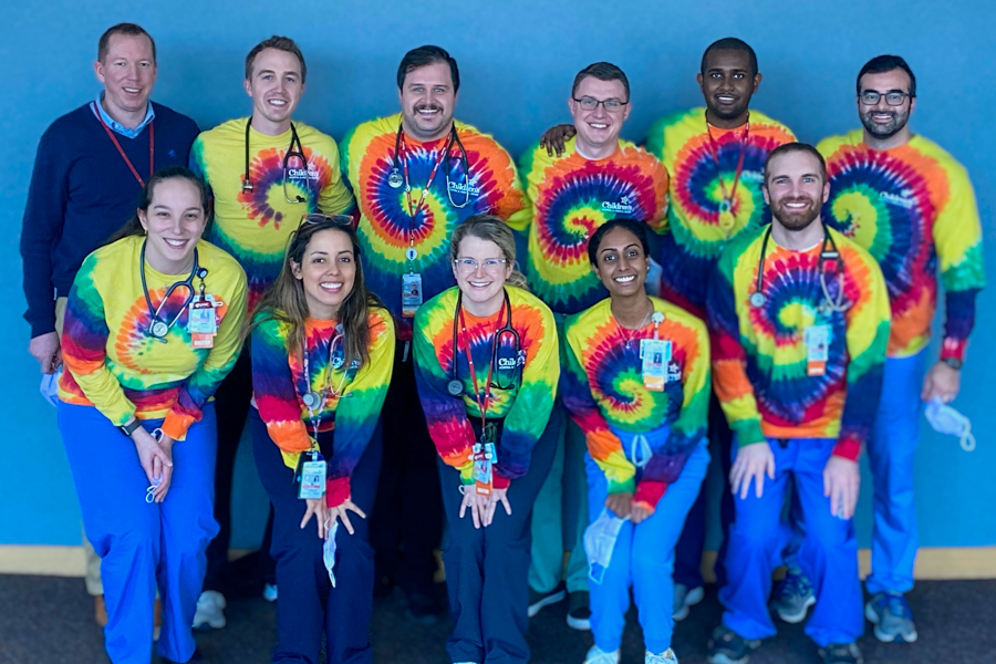 residents wearing tie-dye pride shirts