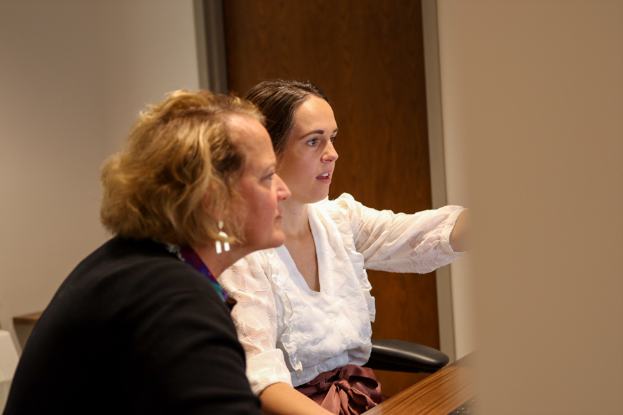resident and resident advisor looking at computer screen