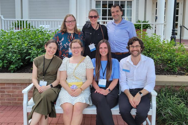 residents at a conference sitting on a bench