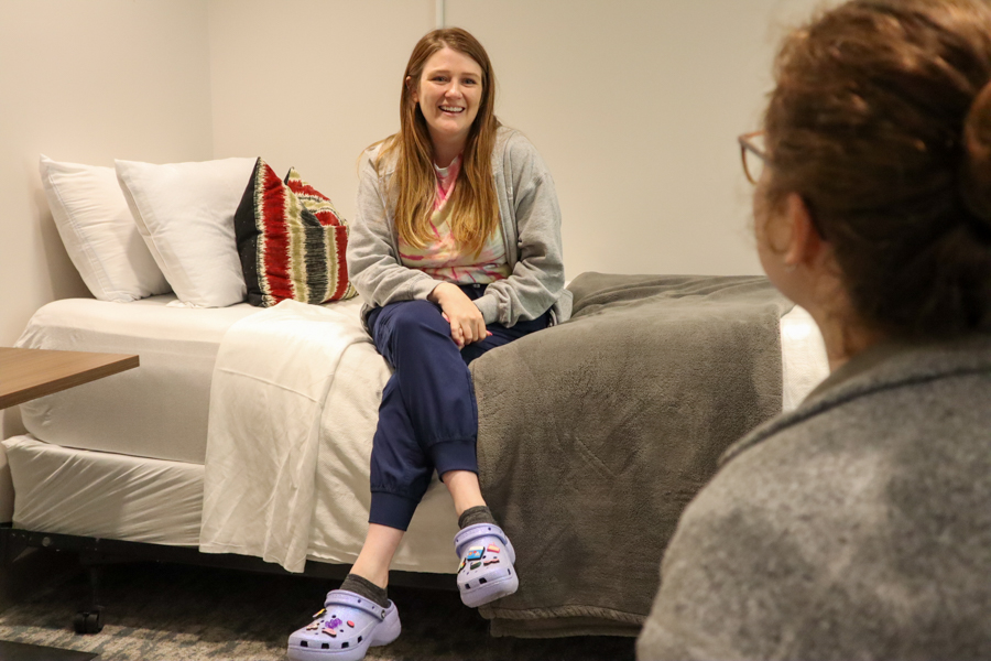 two residents talking to each other in the residency room