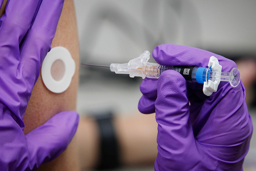 close up of a flu shot being administered.