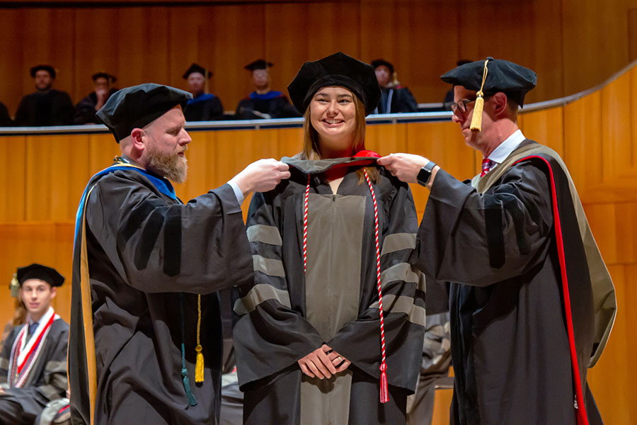 student receiving their doctoral hood