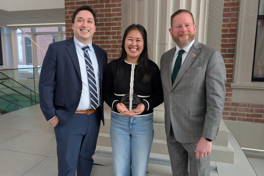 Dr. Sunagawa with award and her HIV clinic team