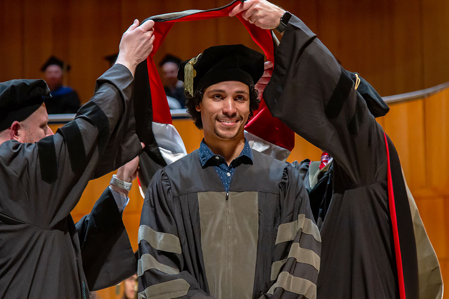 Student receiving their doctoral hood