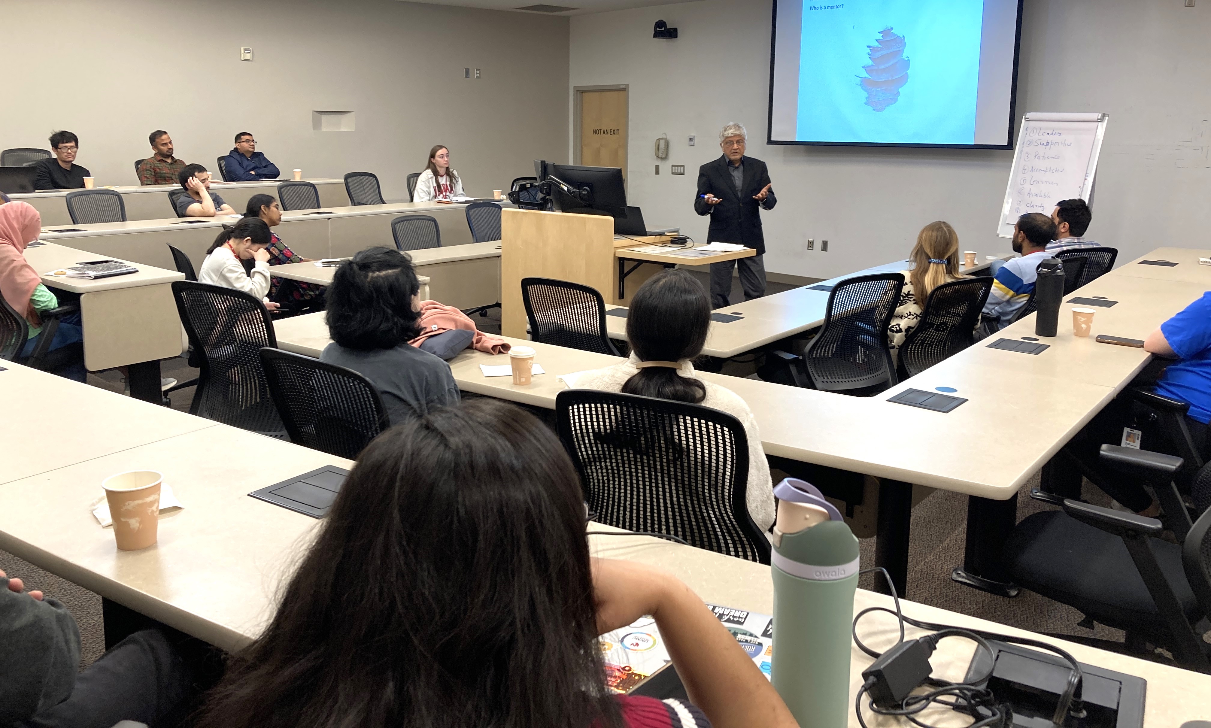 Dr. Ahmad presents a seminar to a room full of students