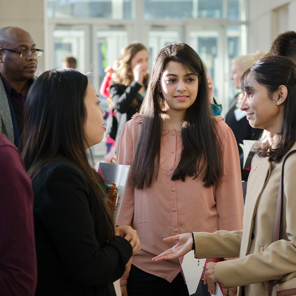 Crowd of people mingle during an event