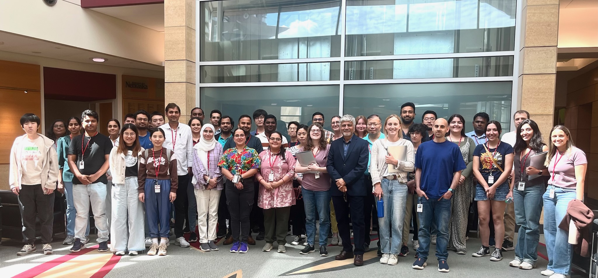 Postdoctoral students pose for a photo with Dr. Ahmad