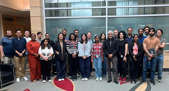 Postdoctoral scholars at Orientation smile at the camera