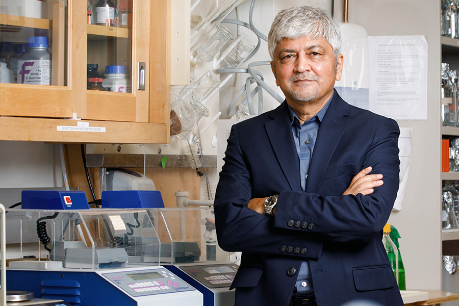 Dr. Iqbal Ahmad poses in his lab