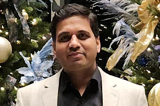 Deepender Kaushik poses for a headshot