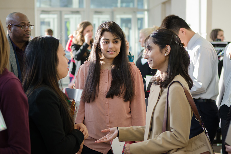 Crowd of people gathered to talk during an event