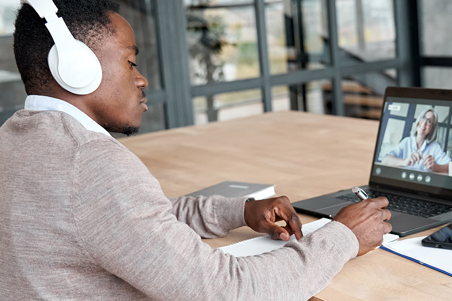 Person sitting at computer doing just-in-time learning