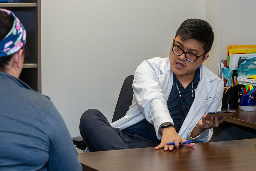 UNMC psychiatry resident talks with a patient