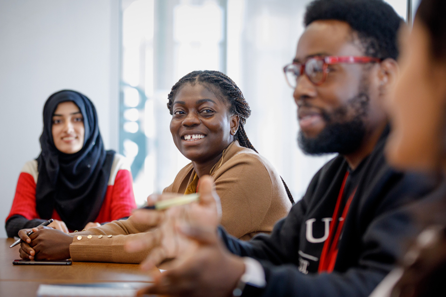 Students gathered in conversation during a class