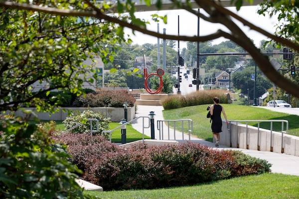 A person walking across campus.