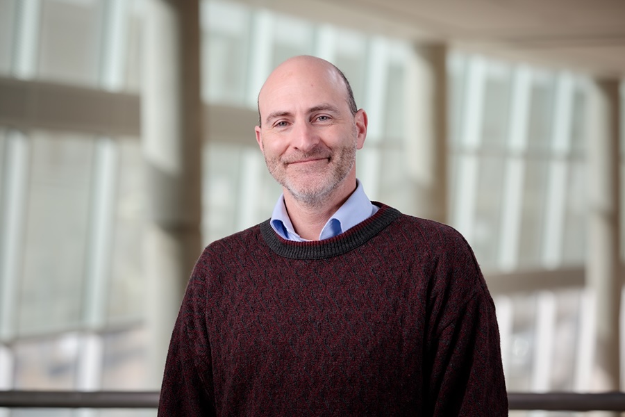 Professional headshot of David Brett-Major.