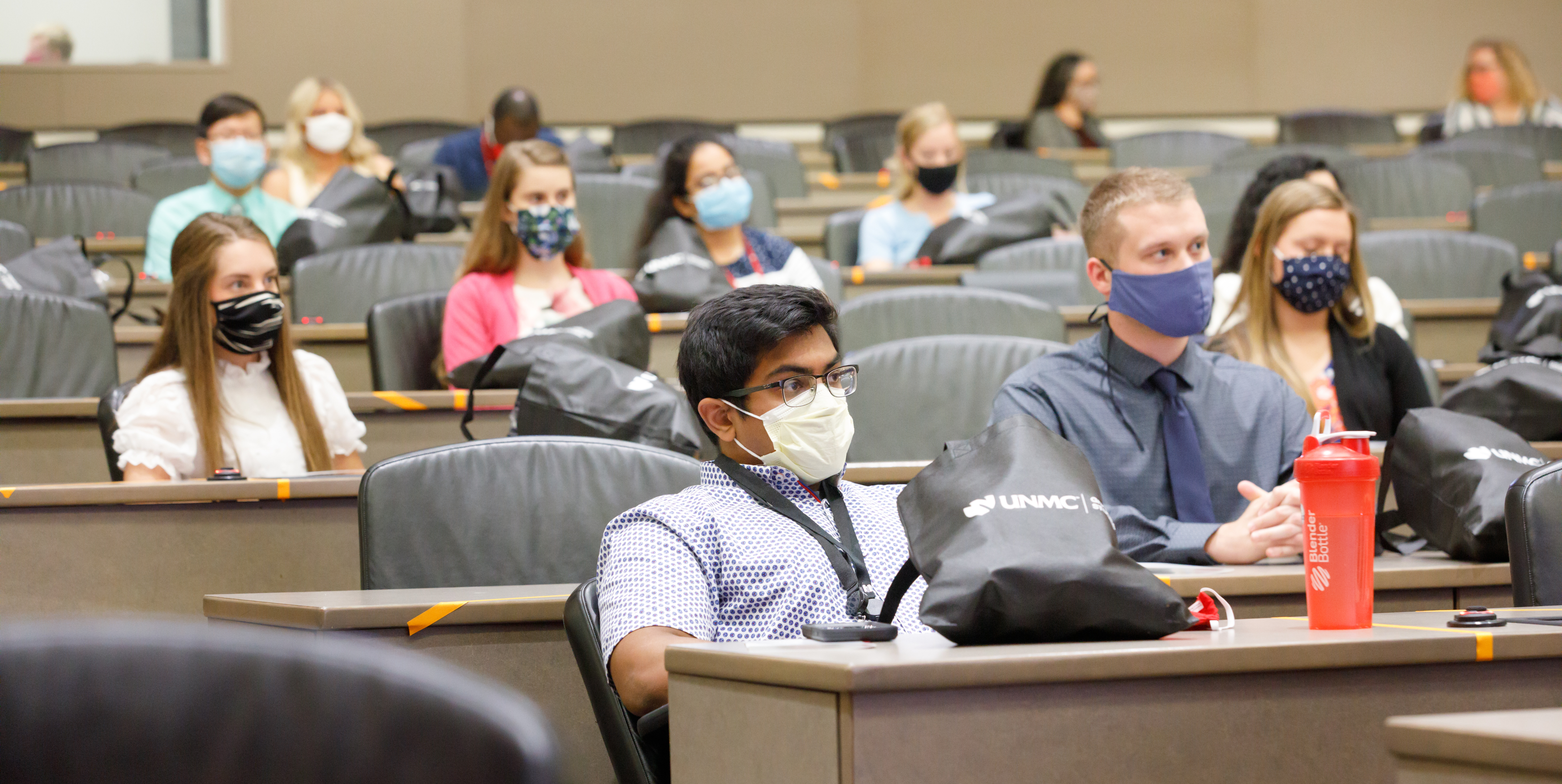Students learning in classroom auditorium