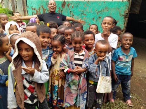 Image of a group of young children smiling for the camera.