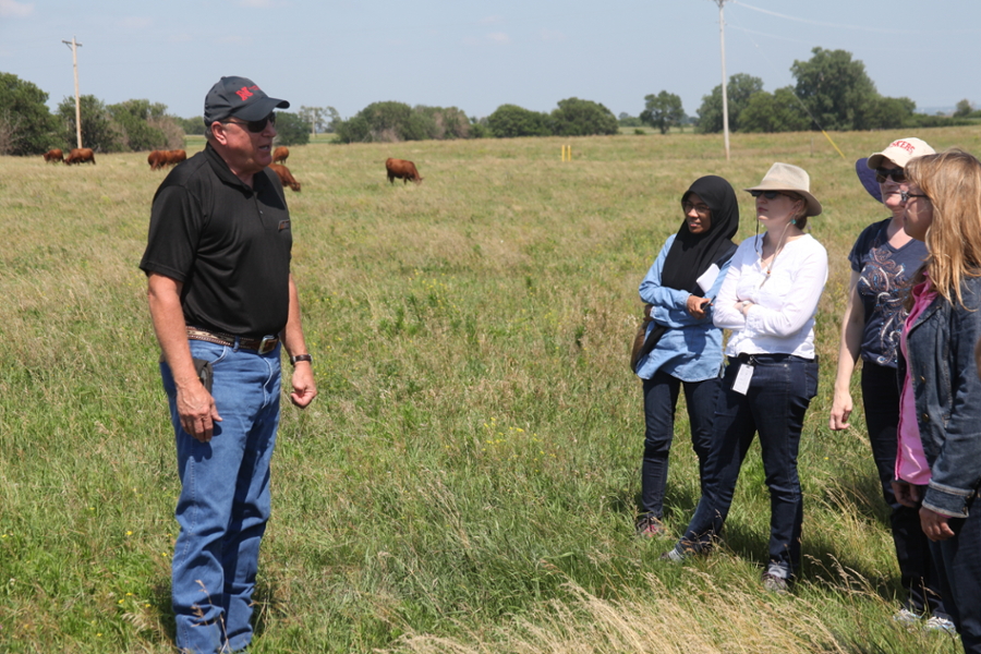 Instructor and group in field