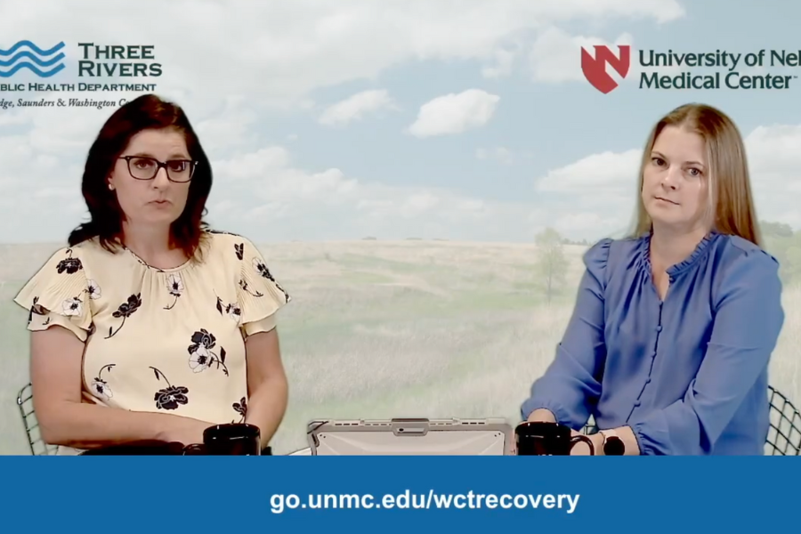 Terra Uhing and Kristina Kintziger sit together at a table