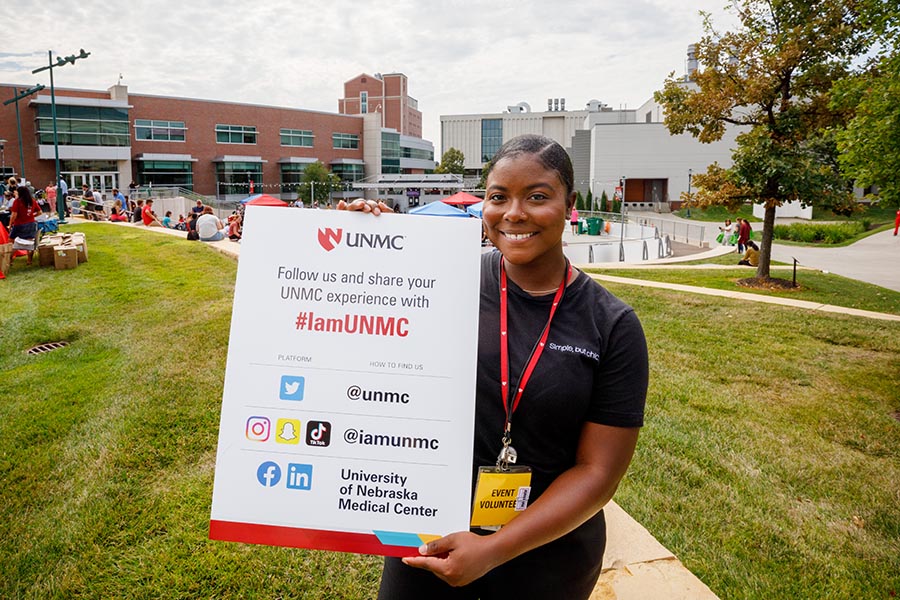 A staff member posts about a UNMC event on social media