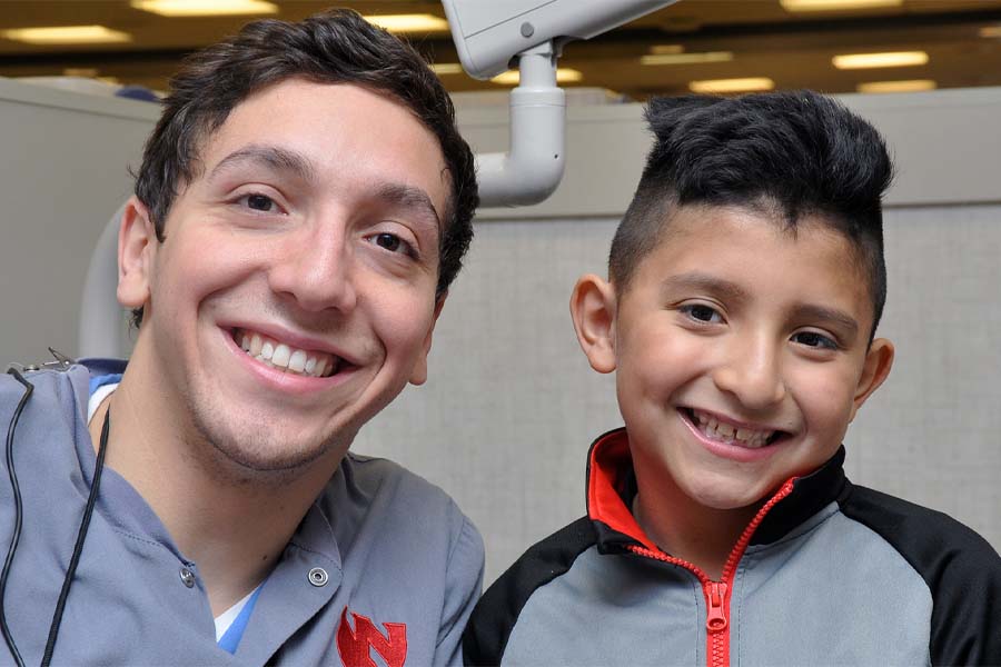 A male dental student and a young male patient