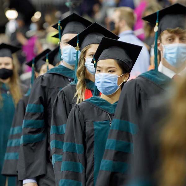 UNMC students in graduation robes