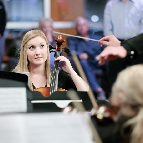 A woman plays a cello