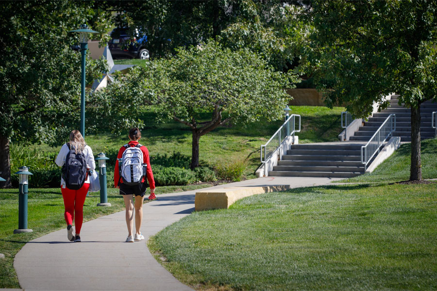 Two students walking on the Omaha campus