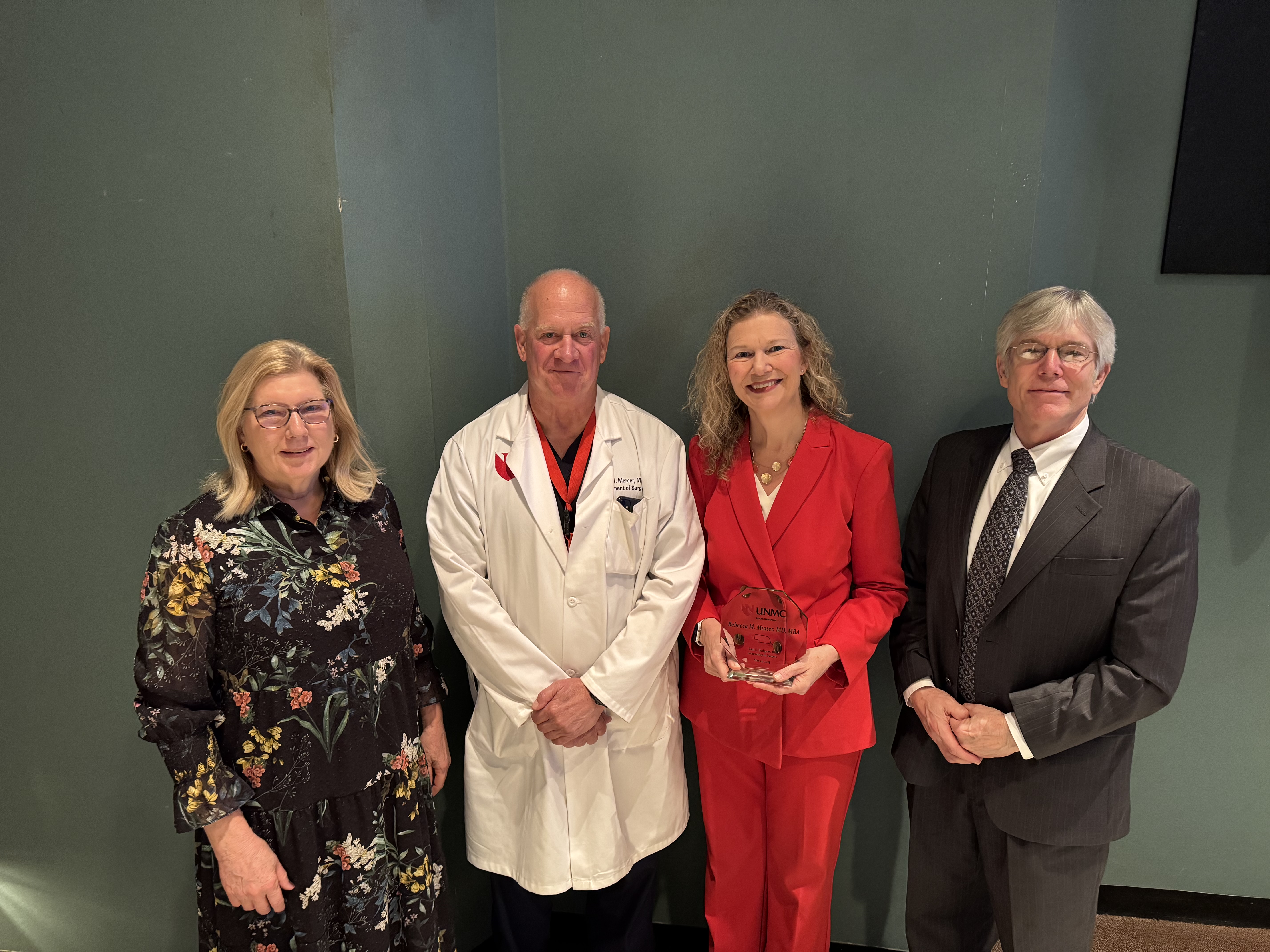 Surgery Chairman David W. Mercer, MD hosts Dr. Rebecca Minter with Hodgson children for the 2025 Paul E. Hodgson Lectureship.